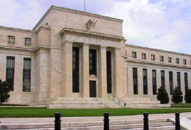 Fed holds interest rates steady, downplays economic weakness